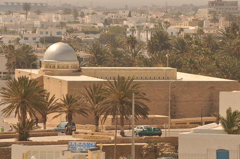 Great Mosque of Mahdia, coastal monument with sober facades, rectangular layout, and monumental entrance