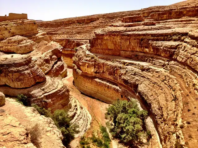 Midès, mountain oasis in southwestern Tunisia, known for its dramatic canyon, palm grove, and natural heritage