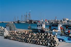 Houmt Souk Port in Djerba, renowned fishing harbor known for sponge and octopus fishing, maritime heart of the island